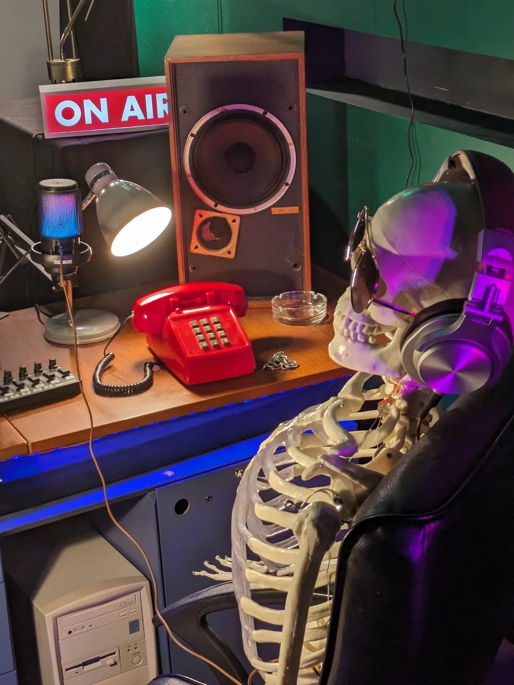 An escape room set at Case Closed — skeleton at an On Air radio desk